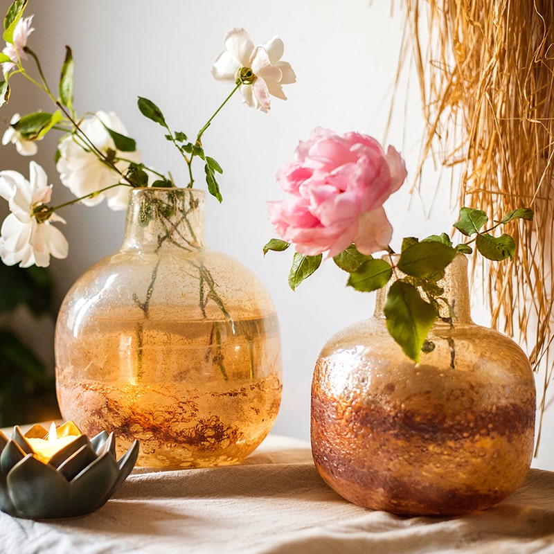 AMBER and Gold Glitter Wide opening Hand Blown vase with retail a pedestal base.